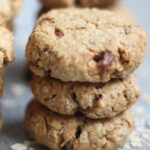 peanut butter and oat cookies stacked on a table