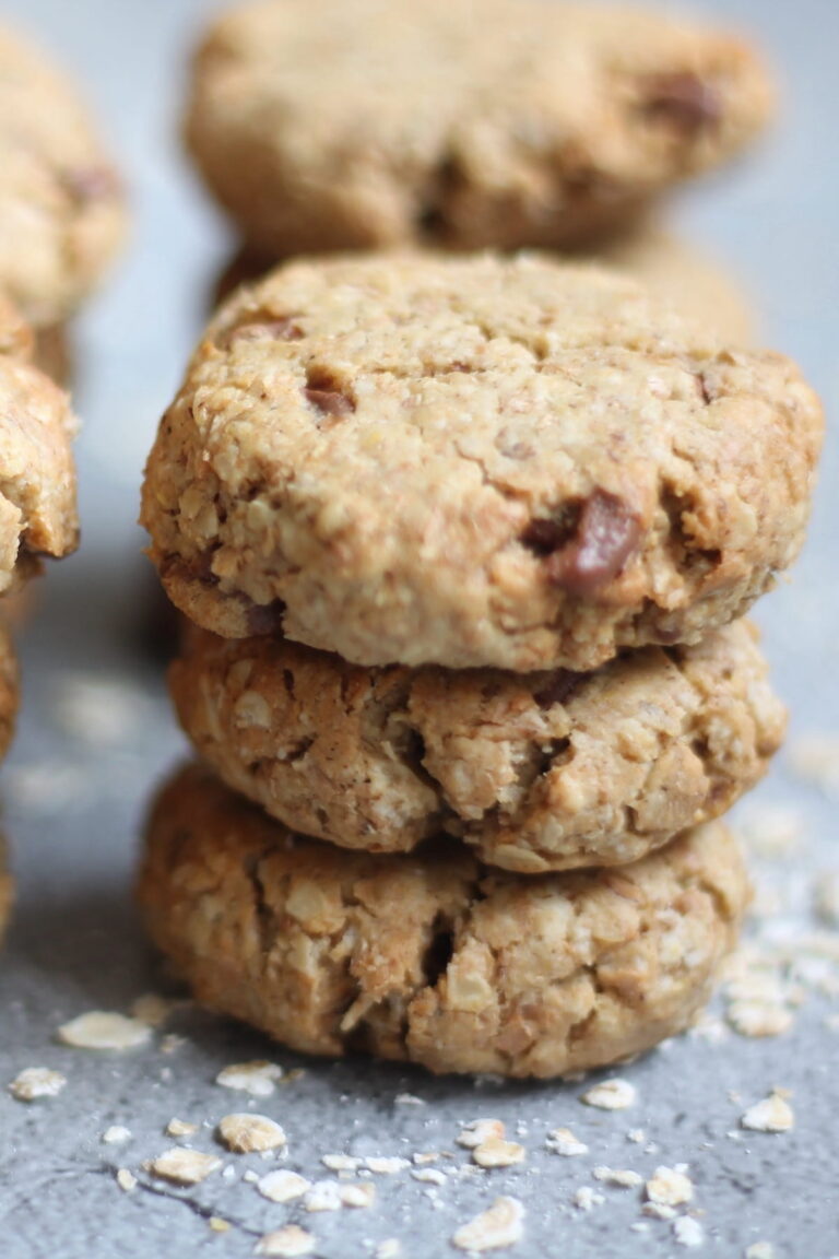 peanut butter and oat cookies stacked on a table