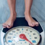 a woman standing on a scale
