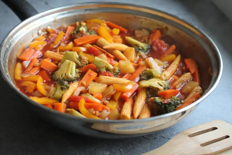 sweet and sour vegetables cooking in a pan