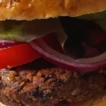 a vegan black bean burger served in a bun