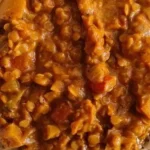 a creamy red lentil curry served with rice