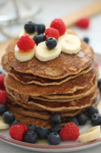 healthy wholewheat vegan pancakes stacked on a plate