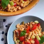 high protein red lentil pasta salad in two bowls