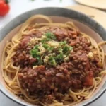 walnut lentil bolognese in a bowl with spaghetti