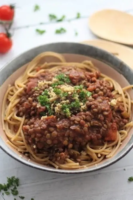 walnut lentil bolognese in a bowl with spaghetti