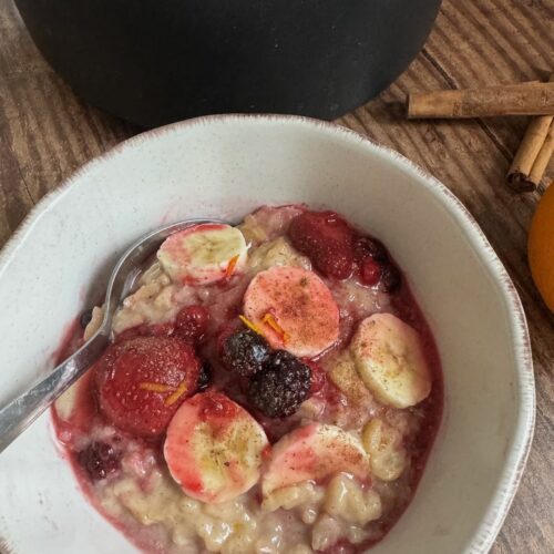 oat milk rice pudding served with berry compote