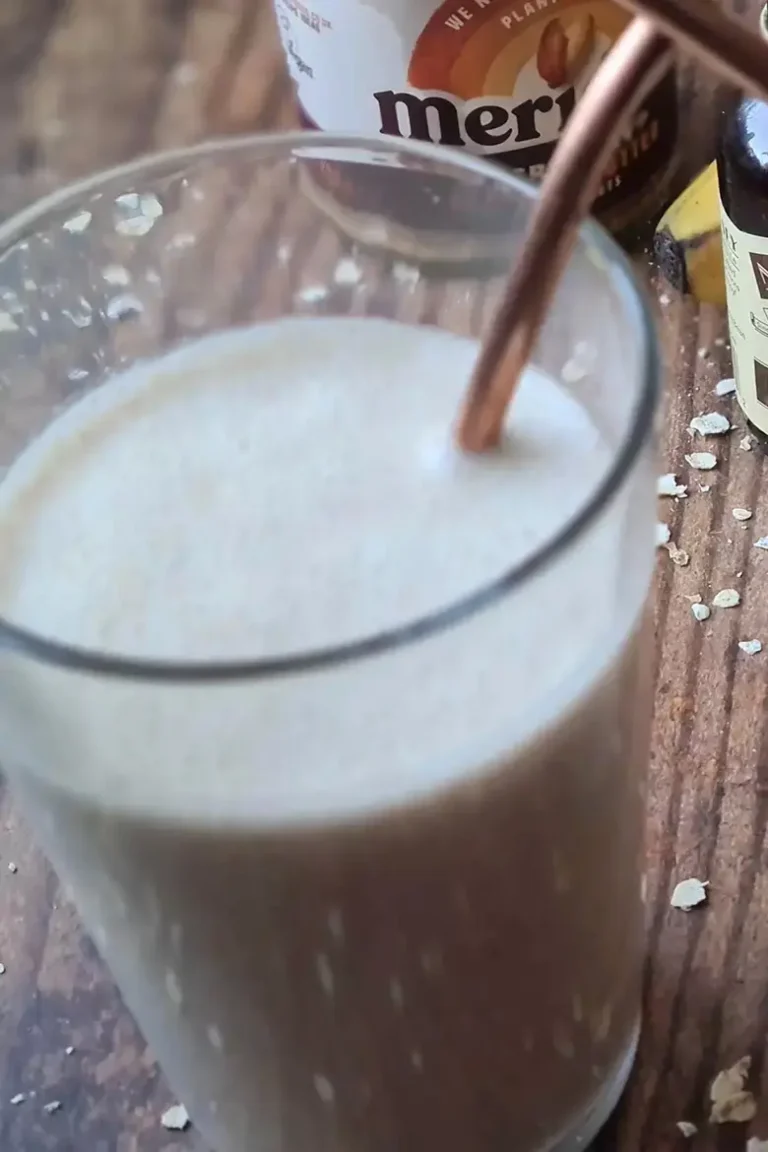 a peanut butter and oat smoothie served in a glass