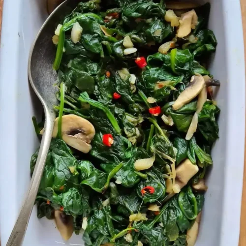 spinach with mushrooms in a dish