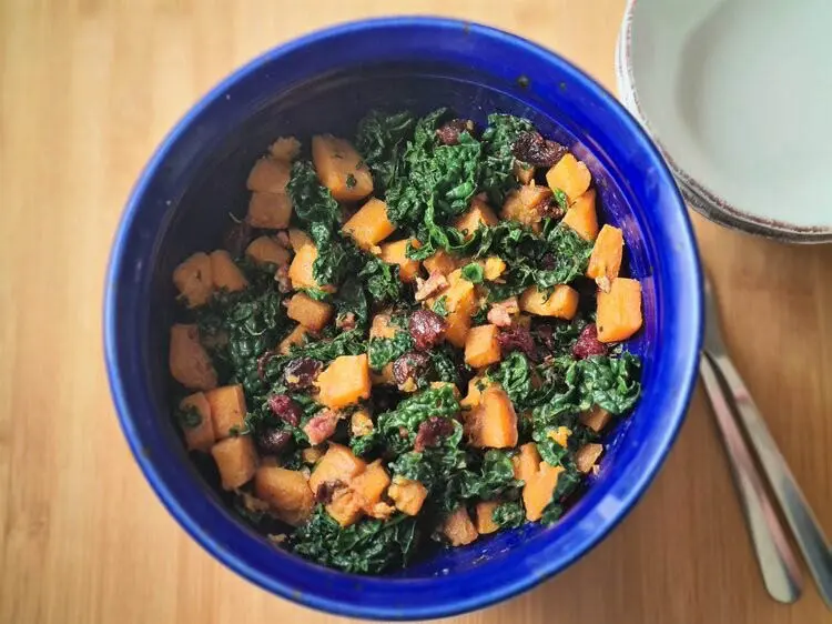 super kale and butternut squash salad in a salad bowl