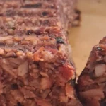 a gluten free vegan mushroom nut roast served on a plate