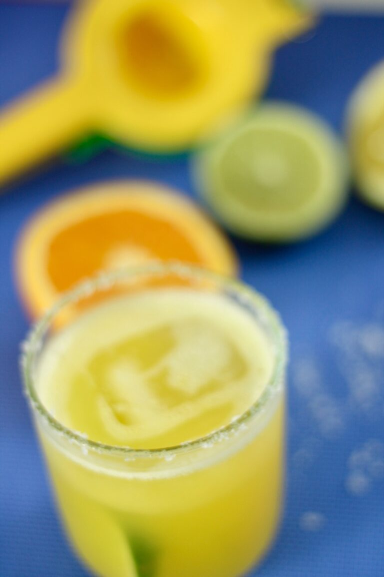 a margarita mocktail served in a glass with with