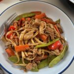Vegan Chinese jackfruit stir fry served with noodles in a bowl