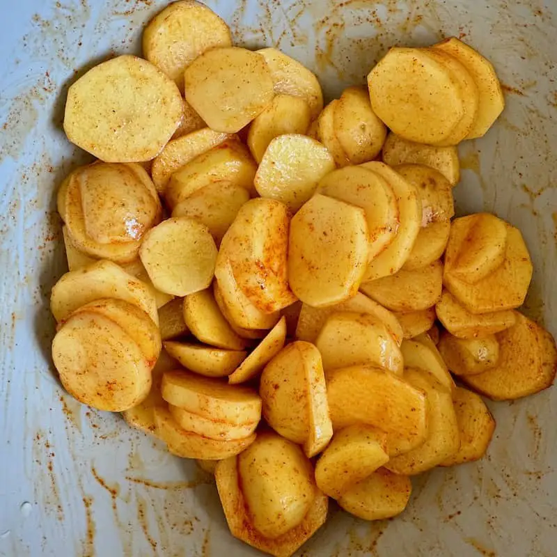 potato sliced mixed with oil and smoked paprika