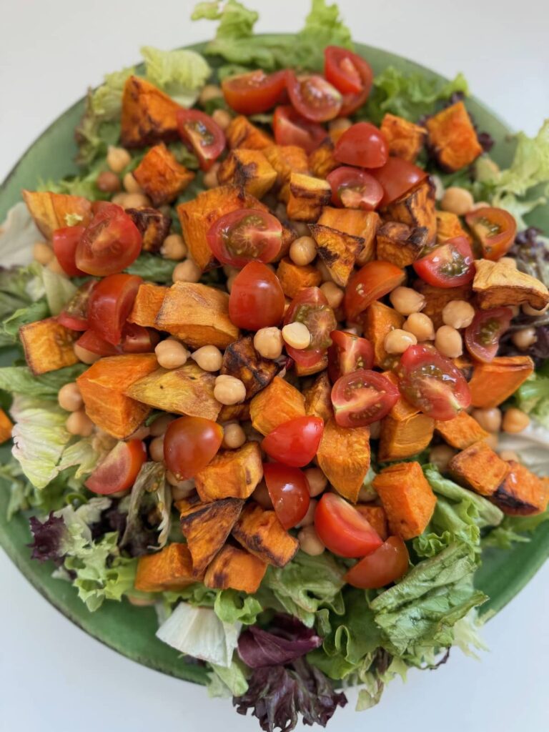 air fryer sweet potato and chickpea salad served on a large plate without dressing