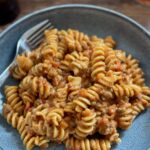 A ten minute creamy vegan pasta with lentils served in a bowl.
