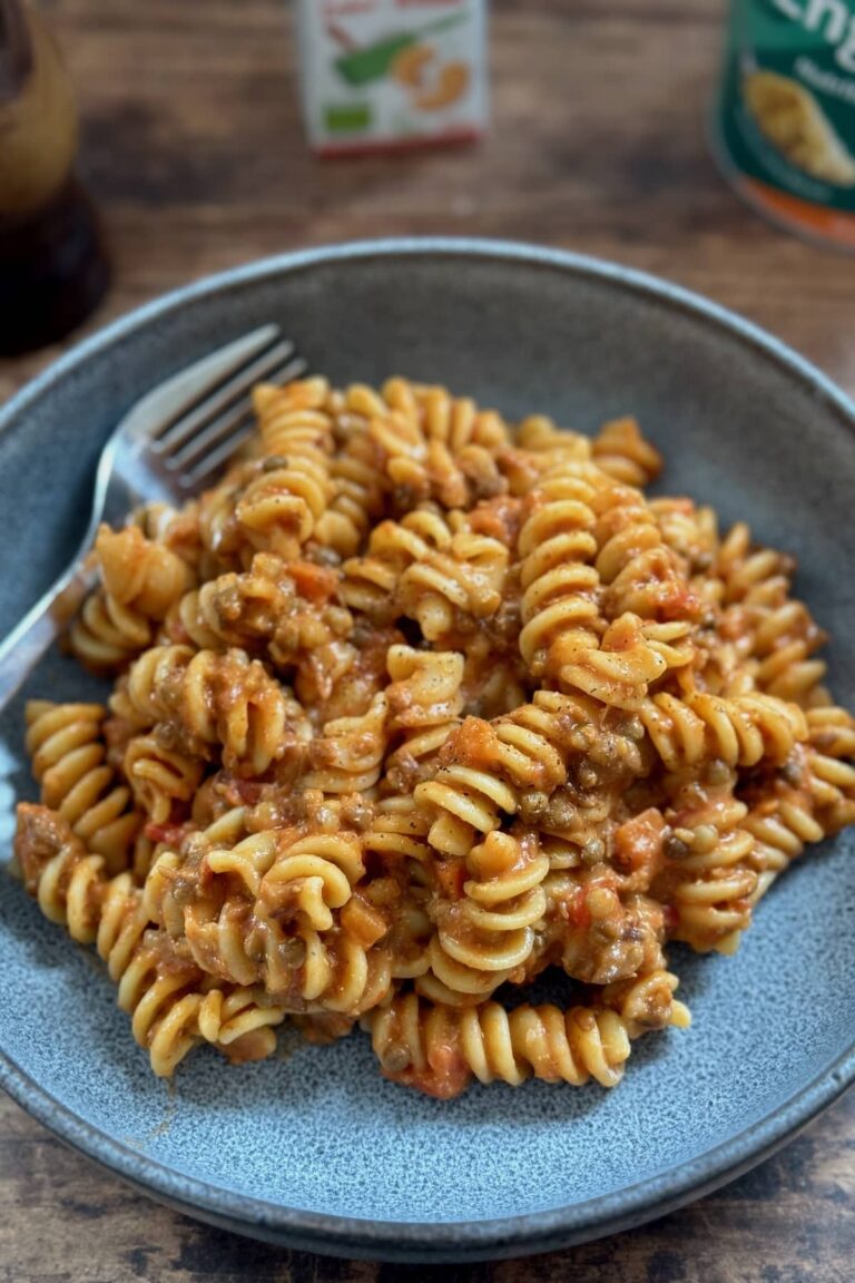 A ten minute creamy vegan pasta with lentils served in a bowl.