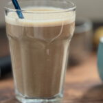 Coffee banana and oat smoothie served in a glass