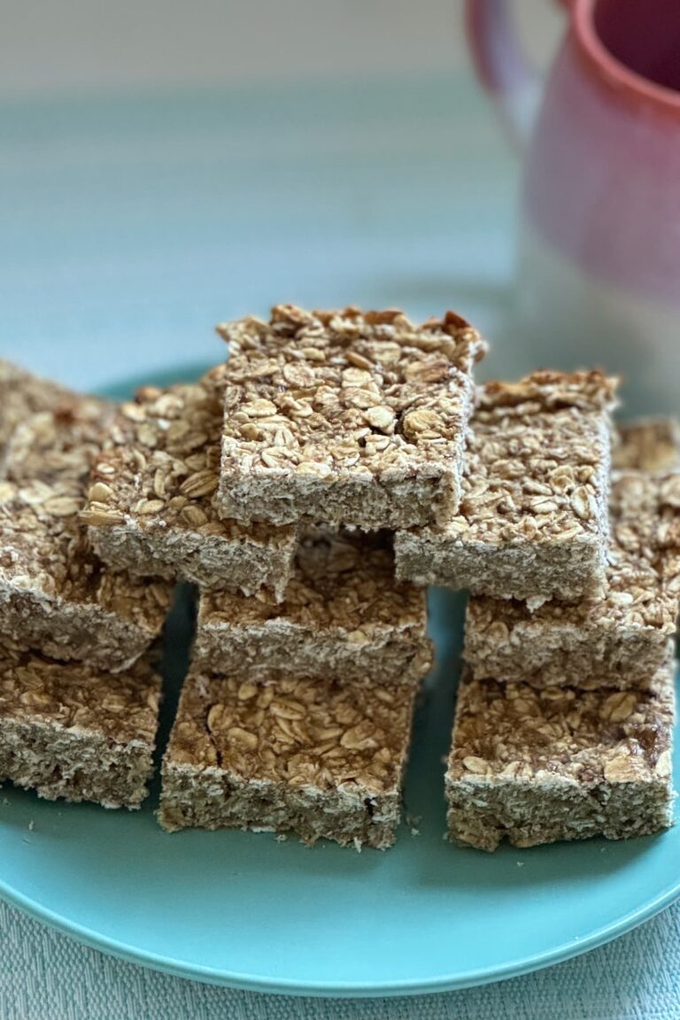 low calorie breakfast oat bars laid out on a plate with a coffee