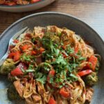 veggie stir fry with peanut lime sauce served in a bowl and ready to eat