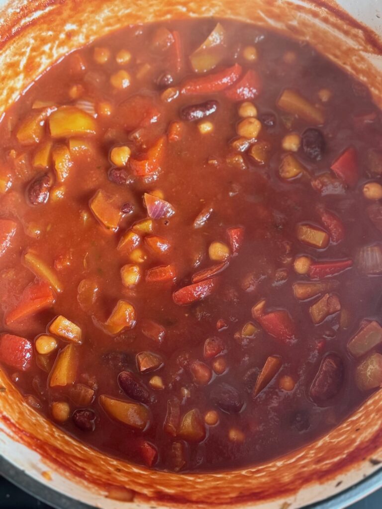 veggie and bean chilli cooking in a big pot