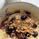 soya yoghurt with protein and berries served in a bowl with granola