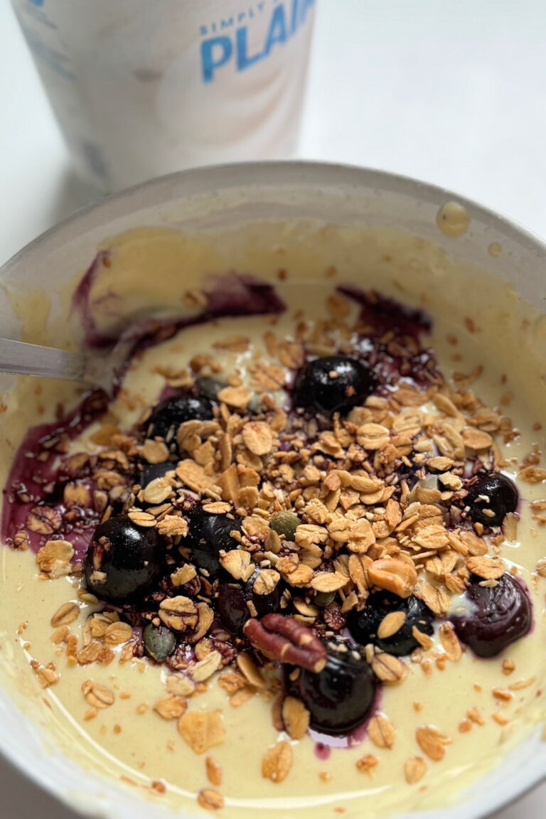 soya yoghurt with protein and berries served in a bowl with granola