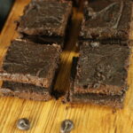 vegan sweet potato brownies laid out on a board