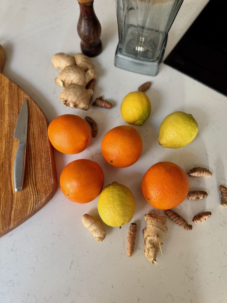 Ginger and Turmeric Citrus Shots Ingredients sitting on a counter